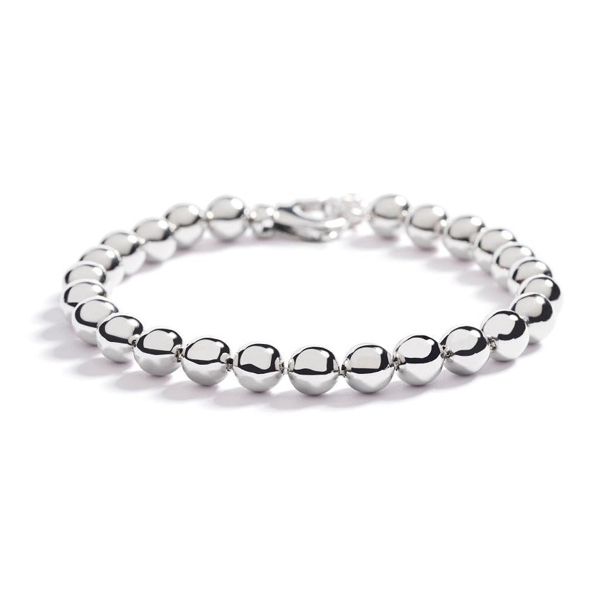 Kuglearmbånd i 18 kt. hvidguld.  Armbåndet findes også i 18 kt. gulguld og 18 kt. rosaguld.